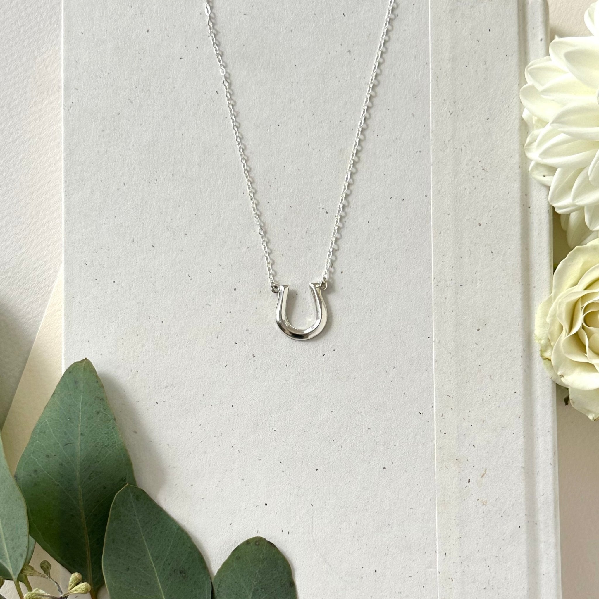 Sterling Silver Horseshoe Pendant with Diamonds and Black Spinel Sterling Silver Horseshoe Pendant with Diamonds and Black Spinel