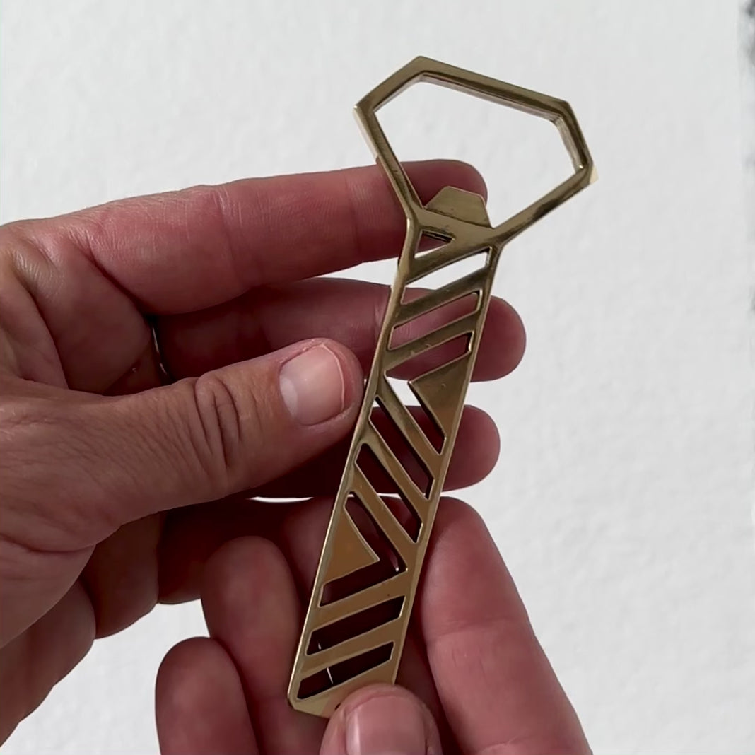 video of a geometric brass bottle opener