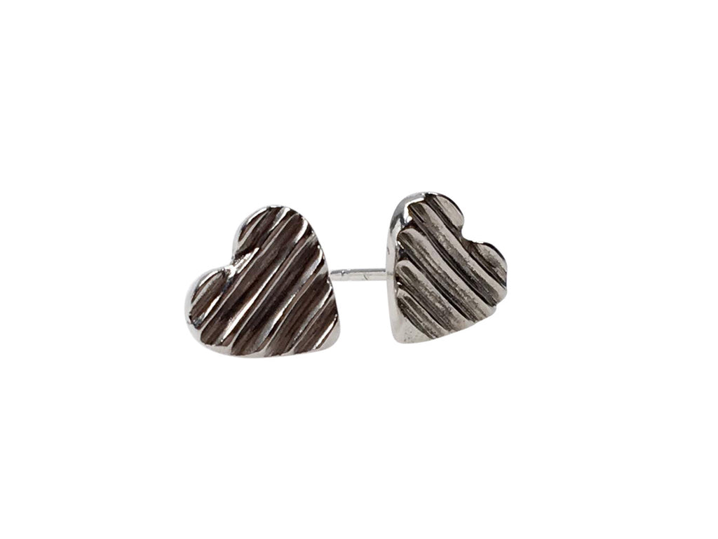 SILVER CARVED HEART STUDS