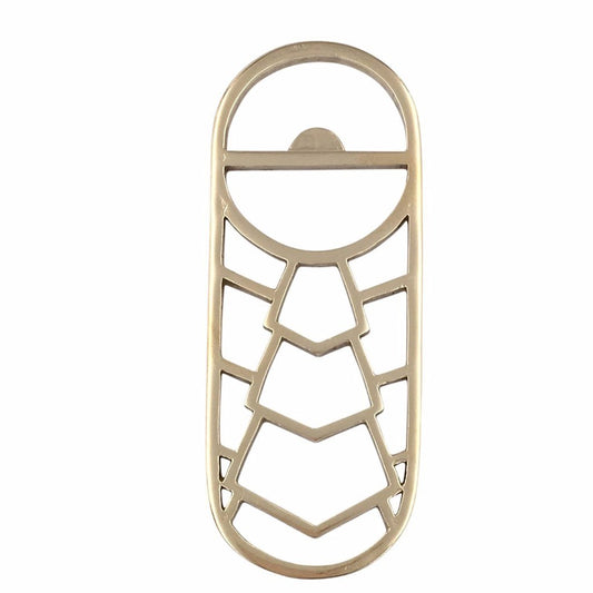 A geometric brass bottle opener on a white background 